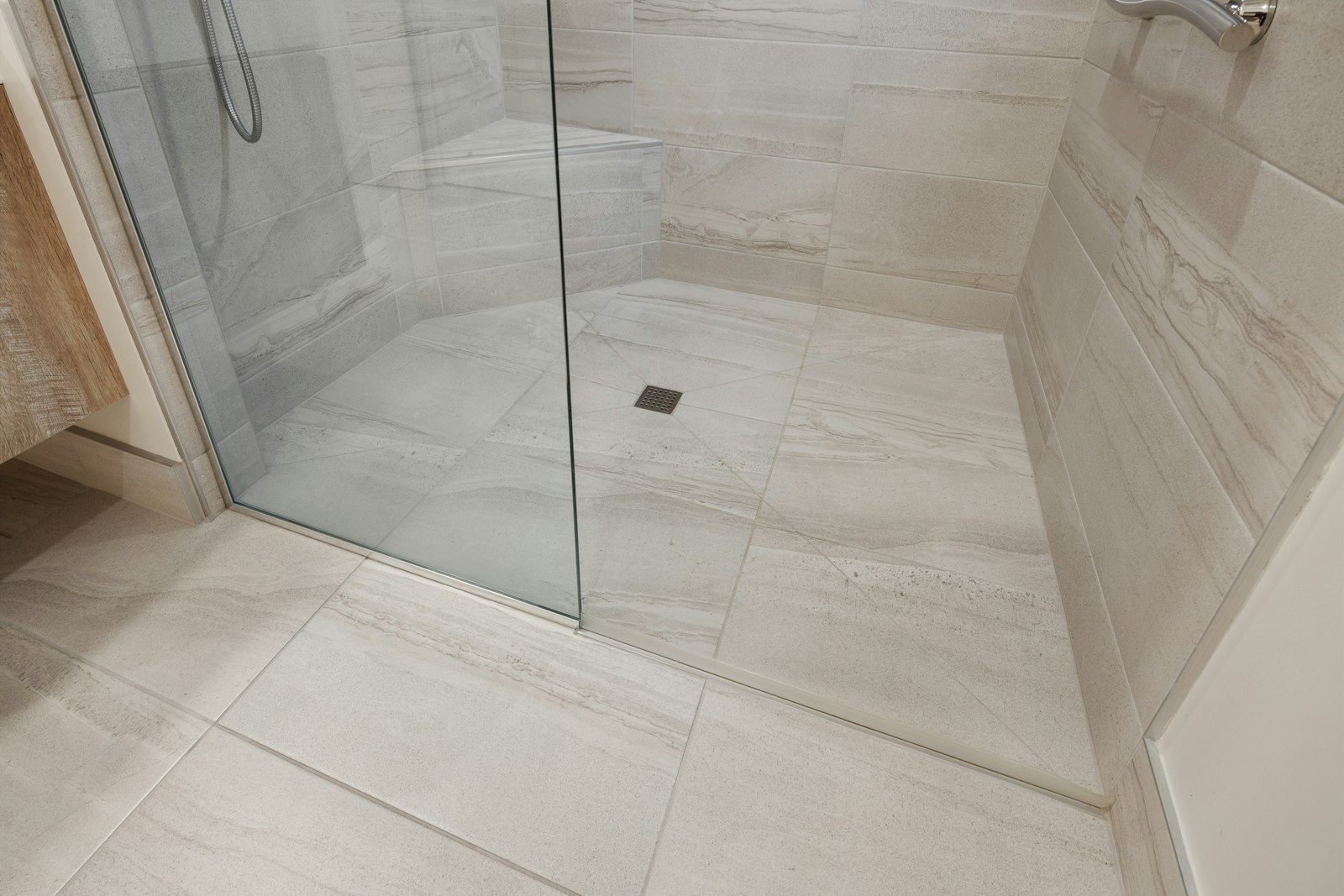 Tiled bathroom shower with clean grout lines